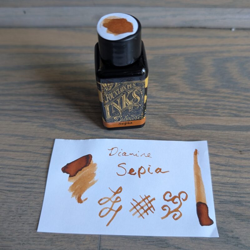 Diamine Sepia fountain ink bottle and swatch. It's a sepia brown/orange coloured ink as one might expect from the name.