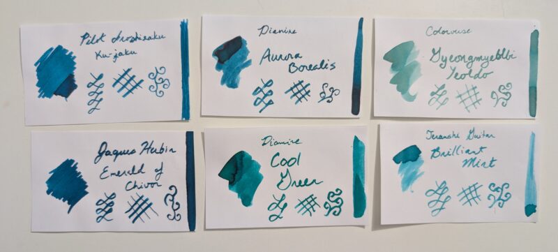 A set of ink swatches to compare with Diamine Cool Green. Top three, left to right: Pilot Iroshizuku ku-jaku, Diamine Aurora Borealis, Colorverse Gyeongmyeble Yealdo. Bottom row: Jaques Herbin Emerald of Chivor, Diamine Cool Green, Teranshi Guitar Brilliant Mint.